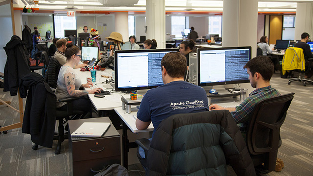 Two software engineers pair programming at Braintree.